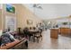 Open dining area with tile floors, high ceilings, and abundant natural light at 5914 Rose Sage St, North Las Vegas, NV 89031