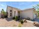 Inviting single-story home with desert landscaping, decorative rock, and a covered entryway at 5914 Rose Sage St, North Las Vegas, NV 89031