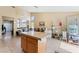 Open floorplan kitchen with a central island and an abundance of natural light at 5914 Rose Sage St, North Las Vegas, NV 89031