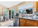 Well-lit kitchen with stainless steel appliances and a window view of the backyard at 5914 Rose Sage St, North Las Vegas, NV 89031