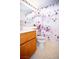 Cozy bathroom with decorative shower curtain, wooden vanity, and soft lighting at 6249 Halehaven Dr, Las Vegas, NV 89110