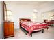 Comfortable bedroom featuring a large bed, dresser, and ample natural light at 6249 Halehaven Dr, Las Vegas, NV 89110