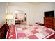 Bright bedroom with a cozy bed, dresser, and a mirrored closet reflecting the bedroom at 6249 Halehaven Dr, Las Vegas, NV 89110