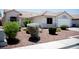 Desert landscaping with gravel and shrubbery complements this single-story home's exterior at 6249 Halehaven Dr, Las Vegas, NV 89110