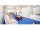 Spacious living room with vaulted ceilings, recessed lighting, and blue carpet at 6249 Halehaven Dr, Las Vegas, NV 89110
