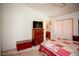 Bright main bedroom with a ceiling fan, neutral walls, and ensuite bathroom for added privacy and convenience at 6249 Halehaven Dr, Las Vegas, NV 89110