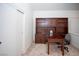 Well-lit office space with a large desk, built-in bookcase, and a comfortable chair at 6249 Halehaven Dr, Las Vegas, NV 89110