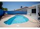 Backyard pool offering a refreshing oasis with blue accent wall for outdoor relaxation and enjoyment at 6249 Halehaven Dr, Las Vegas, NV 89110