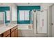 Bright bathroom with large tub and glass enclosed shower at 635 Taliput Palm Pl, Henderson, NV 89011