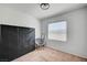 Simple bedroom with a chair, large window, and carpet at 635 Taliput Palm Pl, Henderson, NV 89011
