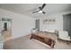 Bright bedroom features a ceiling fan and neutral decor at 635 Taliput Palm Pl, Henderson, NV 89011