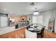 Open dining area adjoining kitchen featuring a modern chandelier and kitchen bar seating at 635 Taliput Palm Pl, Henderson, NV 89011