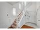 Welcoming two-story entryway features a staircase and natural light from the windows at 635 Taliput Palm Pl, Henderson, NV 89011
