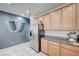 Modern kitchen with stainless steel fridge, ample cabinets, and granite countertops at 635 Taliput Palm Pl, Henderson, NV 89011