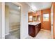 Bathroom featuring double vanity, soaking tub, and walk-in closet entrance at 6569 Cedar Waxwing St, North Las Vegas, NV 89084