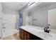 Bathroom with a shower and tub combination, tile flooring and a dark wood vanity at 6569 Cedar Waxwing St, North Las Vegas, NV 89084