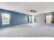 Spacious primary bedroom with large windows offering views of the surrounding neighborhood at 6569 Cedar Waxwing St, North Las Vegas, NV 89084