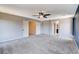 Bright bedroom with plush carpet and a ceiling fan offering ample space and natural light at 6569 Cedar Waxwing St, North Las Vegas, NV 89084