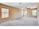 Bright bedroom with neutral walls, plush carpet, and multiple windows offering plenty of natural light at 6569 Cedar Waxwing St, North Las Vegas, NV 89084