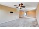 Bonus room featuring plush carpeting, a ceiling fan, and easy access to other rooms at 6569 Cedar Waxwing St, North Las Vegas, NV 89084