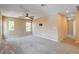 Spacious bonus room with plush carpeting, a ceiling fan, and lots of natural light at 6569 Cedar Waxwing St, North Las Vegas, NV 89084