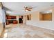Open floor plan features tile flooring and a spacious living area with easy access to kitchen at 6569 Cedar Waxwing St, North Las Vegas, NV 89084