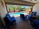 Relaxing backyard with a pool, spa, and comfortable seating on a covered patio, perfect for entertaining at 6614 Collingsworth St, Las Vegas, NV 89131