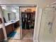 Well-lit bathroom with double sink vanity, walk-in shower, and mirrored closet at 6614 Collingsworth St, Las Vegas, NV 89131