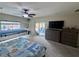 Bedroom featuring carpet, ceiling fan, and a sliding glass door that provides plenty of natural light at 6614 Collingsworth St, Las Vegas, NV 89131