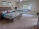 Spacious primary bedroom featuring neutral colors, ceiling fan and natural light at 6614 Collingsworth St, Las Vegas, NV 89131