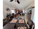 Open concept view from dining room to kitchen, breakfast bar, and living room areas at 6614 Collingsworth St, Las Vegas, NV 89131