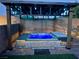 Backyard hot tub featuring a wooden pergola with decorative lighting at 6614 Collingsworth St, Las Vegas, NV 89131