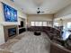 Spacious living room features a comfortable sectional sofa and a fireplace creating a cozy atmosphere at 6614 Collingsworth St, Las Vegas, NV 89131