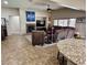 Open concept living room showcasing fireplace, furniture and seamless flow to dining and kitchen areas at 6614 Collingsworth St, Las Vegas, NV 89131