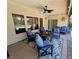 Inviting covered patio featuring comfortable seating, ceiling fan, and views of the sparkling swimming pool at 6614 Collingsworth St, Las Vegas, NV 89131