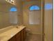 Bathroom featuring a double sink vanity, large mirror and separate toilet and shower area at 700 Carnegie St # 4821, Henderson, NV 89052