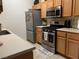 Kitchen featuring stainless steel appliances, light wood cabinets, and a neutral countertop at 700 Carnegie St # 4821, Henderson, NV 89052