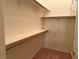 Walk-in closet with installed shelving and rod for storage and organization at 700 Carnegie St # 4821, Henderson, NV 89052