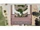 Aerial view of a desert home featuring lush landscaping, circular drive, and attached garages at 825 W Ryan Ave, Overton, NV 89040