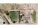 Large desert property with fenced perimeter and a combination of green spaces and functional buildings at 825 W Ryan Ave, Overton, NV 89040