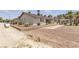 Well-maintained backyard with desert landscaping, retaining wall and a view of a single-story home at 825 W Ryan Ave, Overton, NV 89040