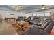 Comfortable seating area in the expansive basement with leather recliners, a coffee table, and a pool table nearby at 825 W Ryan Ave, Overton, NV 89040