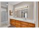 Well-lit bathroom with double vanity and glass enclosed shower at 825 W Ryan Ave, Overton, NV 89040