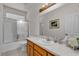 Full bathroom features tile floors, a shower-tub combo and a vanity at 825 W Ryan Ave, Overton, NV 89040