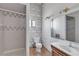 Simple bathroom features a shower stall, toilet, and a sink with an illuminated vanity mirror at 825 W Ryan Ave, Overton, NV 89040