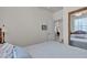Bedroom showcases a ceiling fan and a view of the home office at 825 W Ryan Ave, Overton, NV 89040
