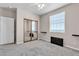 Bedroom featuring a ceiling fan, window, and mirrored closet at 825 W Ryan Ave, Overton, NV 89040