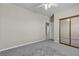 Spacious bedroom with neutral tones, closet, and a ceiling fan at 825 W Ryan Ave, Overton, NV 89040