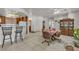 Spacious open-plan dining area featuring tile floors, bar seating, and natural light at 825 W Ryan Ave, Overton, NV 89040