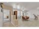 Bright dining area with tile flooring, a ceiling fan, and easy access to adjacent living spaces at 825 W Ryan Ave, Overton, NV 89040